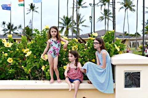 Laie, Hawaii. My three girls are sitting on a short wall on the campus of BYU Hawaii. They're so beautiful and cute. 